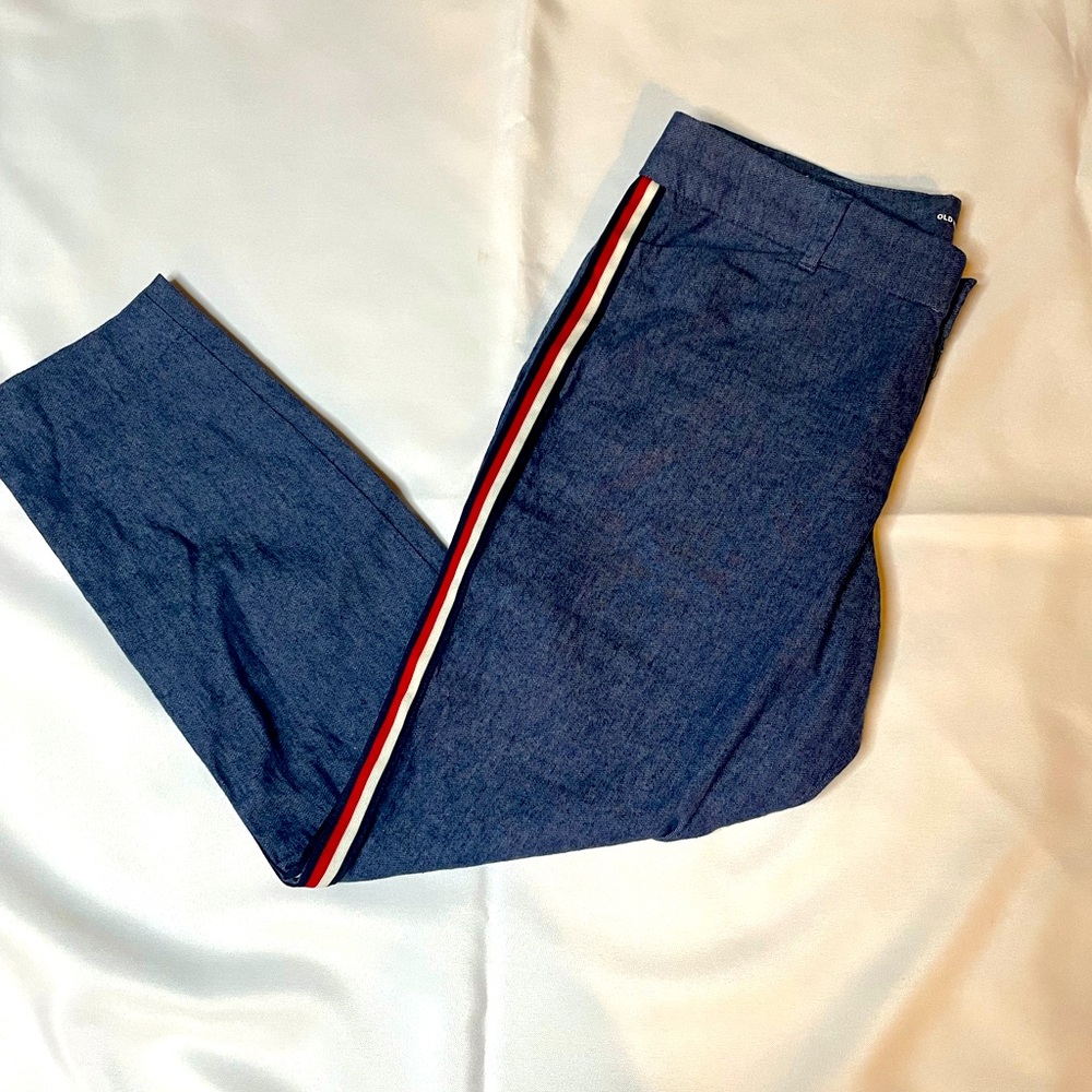 Old navel jean pants with red,white, and blue stripe on the side.